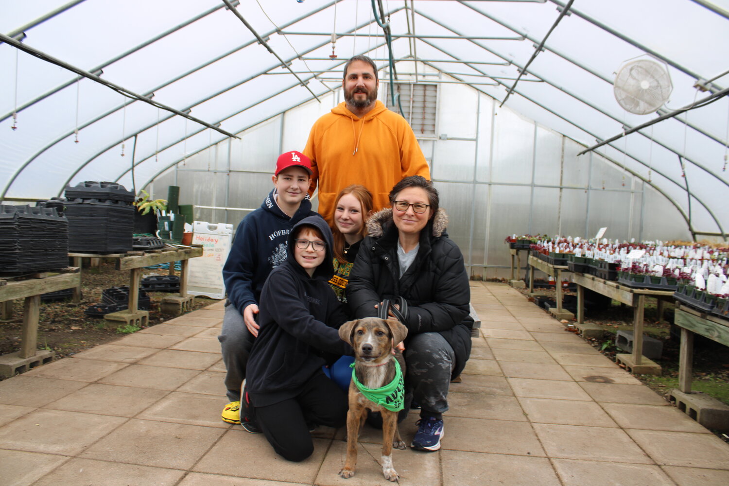 The Feit family with their newly adopted 6-month-old dog named Cash, at Fantastic Gardens. Cash had only arrived at Last Chance a week prior.